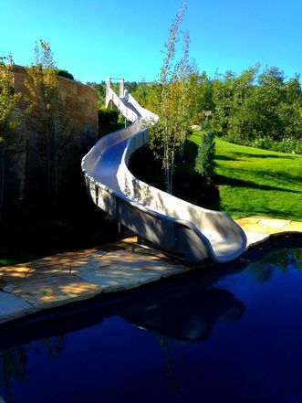 small outdoor grey pool slide